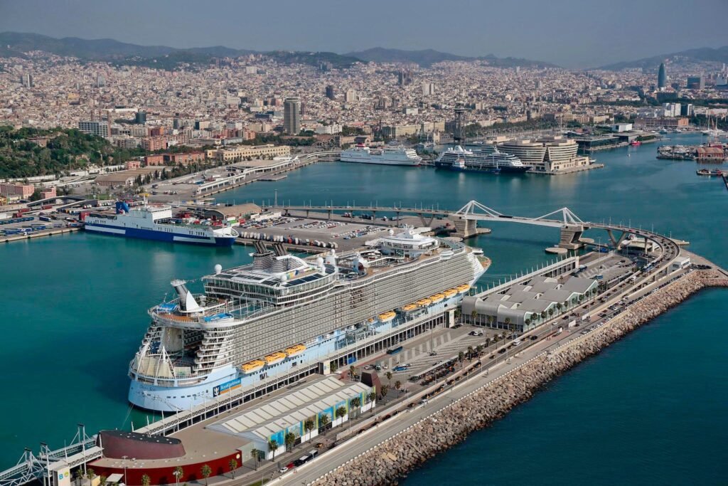 Cruise ship docked at Barcelona's cruise terminals with the city behind, the start of a one-day visit